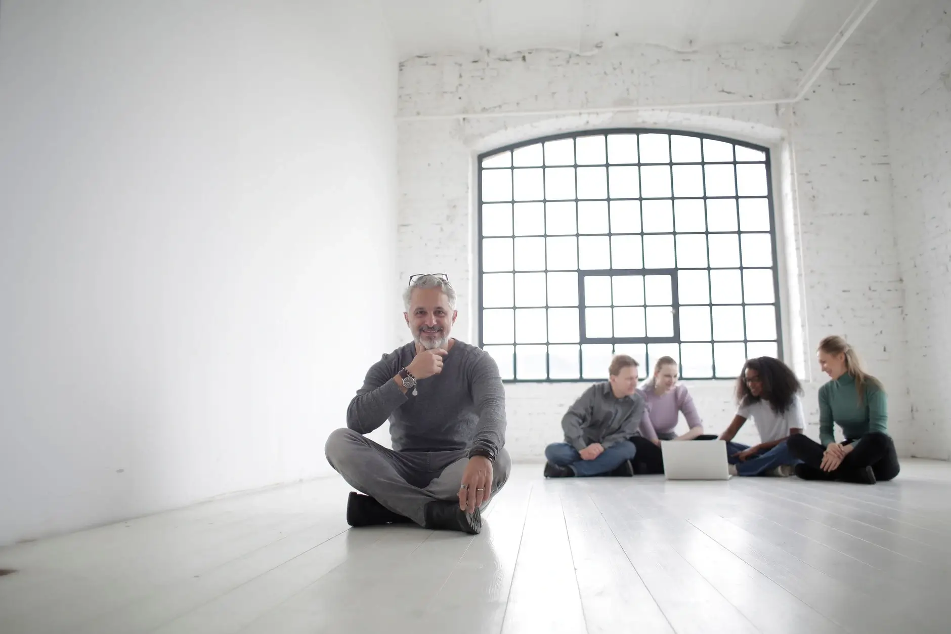 Professional advisors meeting in a glass conference room